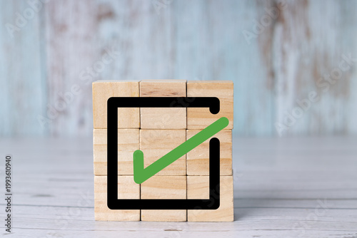 Green Checkmark Icon on Wooden Cubes Task Completed Success Concept