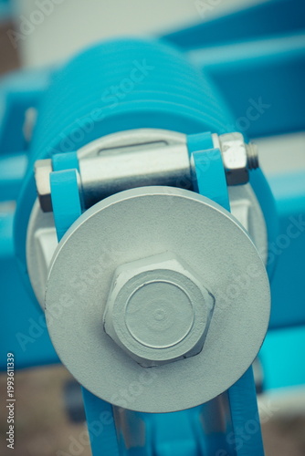 Steel blue spring as part of agricultural machine. Technology