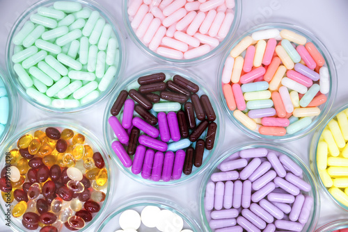 Fotografie Colorful medical capsules top view, Pharmaceutical industry production of assorted vitamins lab