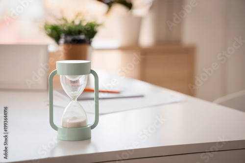 Hourglass on desk in home o...