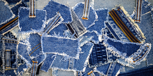 Schilderij op canvas Denim fabric pieces arranged on a surface showing different shades and textures