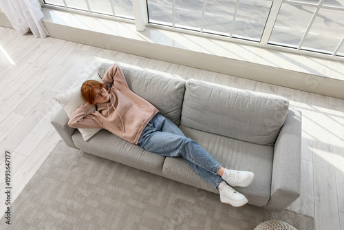 Redhead teenage girl lying ...