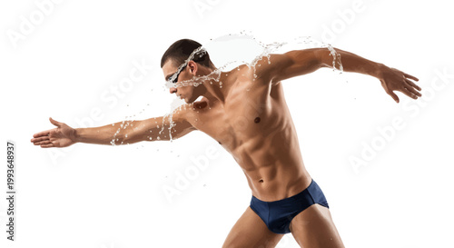 Man in swimming goggles and blue briefs diving into water with arms outstretched