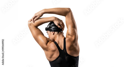 Woman in black swimsuit and swim cap stretching on white background