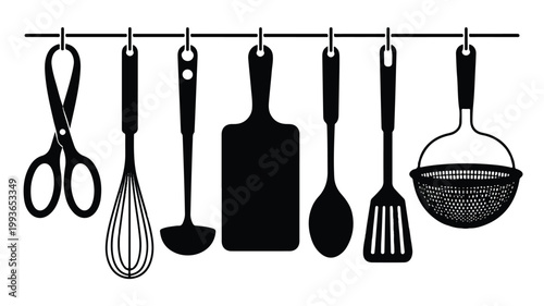 Kitchen utensils hanging on a rail