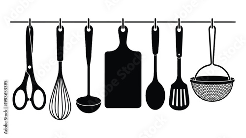 kitchen utensils hanging on a rail