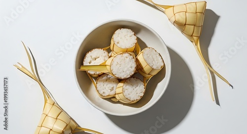Ketupat in bowl with woven cones.