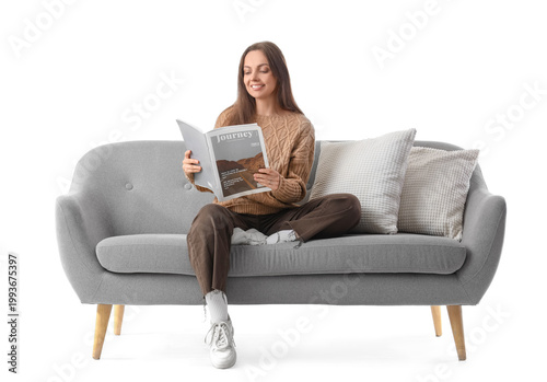 Young woman reading magazin...