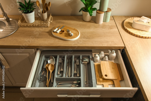Open kitchen drawer with di...