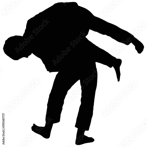 The silhouette of a martial arts performer.