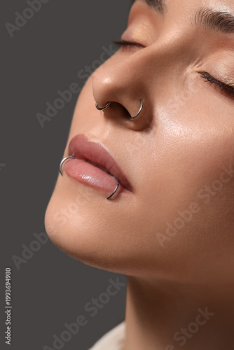 Pretty young woman with nos...