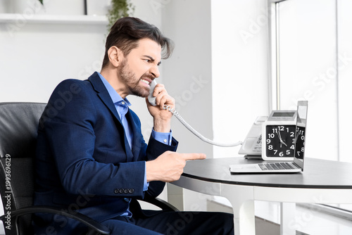 Angry businessman shouting ...
