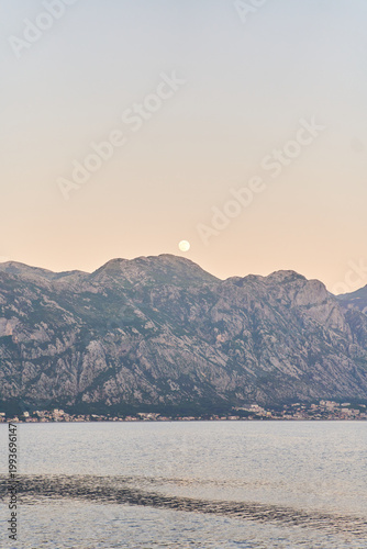 View of the sunset in Boko-Kotor Bay in Montenegro. Silhouettes of mountains. High quality photo