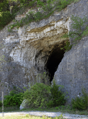 A cave in a rocky cliff.