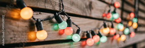 Colorful String Lights on Rustic Wooden Background with Soft Bokeh Glow