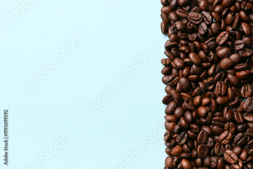 Coffee beans on blue backgr...