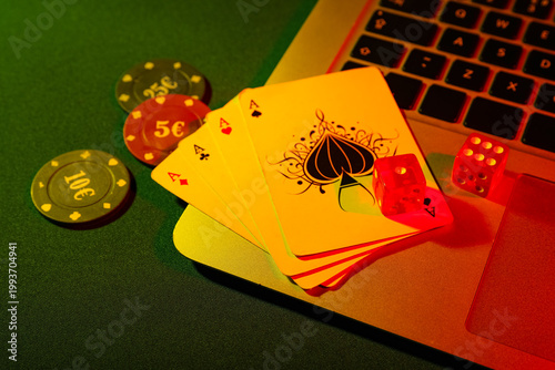 Laptop with playing cards, ...