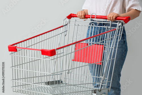 Woman with shopping cart on...
