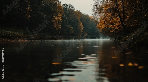 Autumnal river scene reflecting autumnal trees.