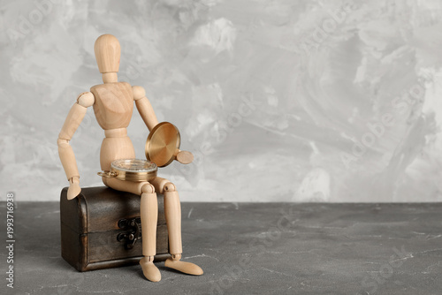 Wooden mannequin with compa...