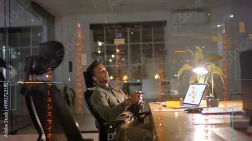 Male business pro receiving phone alert, relaxing and glancing at laptop, orange overlay appearing