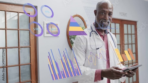 Senior doctor tapping tablet, animating medical charts showing care data, then looking up smiling