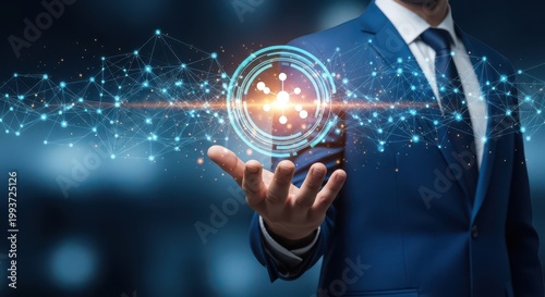Businessman in blue suit presenting a glowing blue molecular structure with connected nodes and lines on his palm in a futuristic setting with a dark blue background