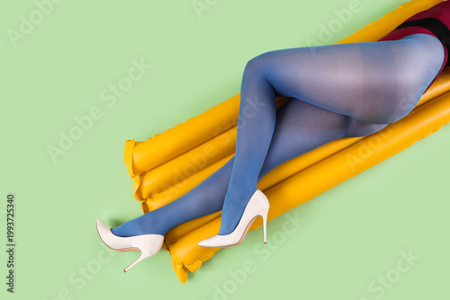 Young woman in blue tights ...