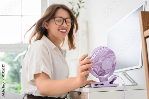 Small electric fan on table...