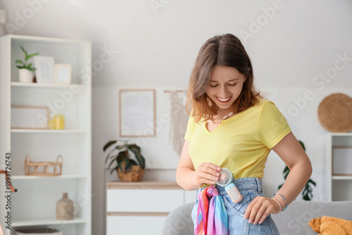 Young woman putting mini fa...