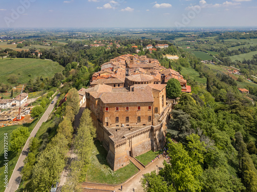 Italy, 10 April 2026: Aerial drone view of Dozza medieval village in Emilia Romagna, featuring the historic Rocca Sforzesca fortress, colorful murals, tiled rooftops, and scenic Italian countryside la