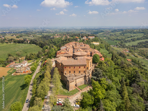 Italy, 10 April 2026: Aerial drone view of Dozza medieval village in Emilia Romagna, featuring the historic Rocca Sforzesca fortress, colorful murals, tiled rooftops, and scenic Italian countryside la