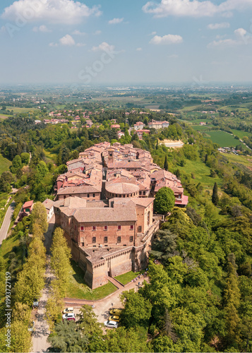 Italy, 10 April 2026: Aerial drone view of Dozza medieval village in Emilia Romagna, featuring the historic Rocca Sforzesca fortress, colorful murals, tiled rooftops, and scenic Italian countryside la