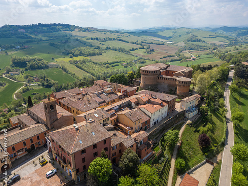 Italy, 10 April 2026: Aerial drone view of Dozza medieval village in Emilia Romagna, featuring the historic Rocca Sforzesca fortress, colorful murals, tiled rooftops, and scenic Italian countryside la
