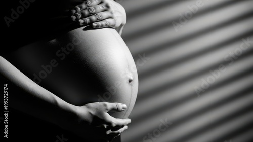 Pregnant belly silhouette with shadow lines and gentle hands