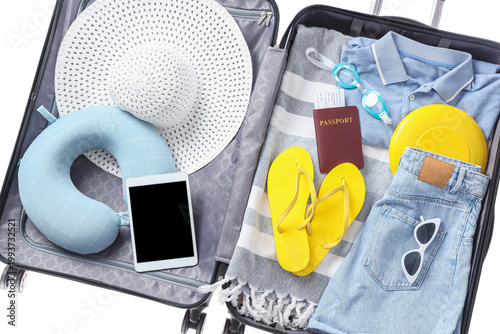 Open suitcase with clothes,...