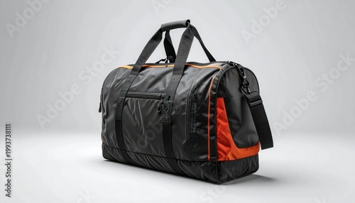 Modern Black Duffel Bag with Orange Accents on a Clean Background.