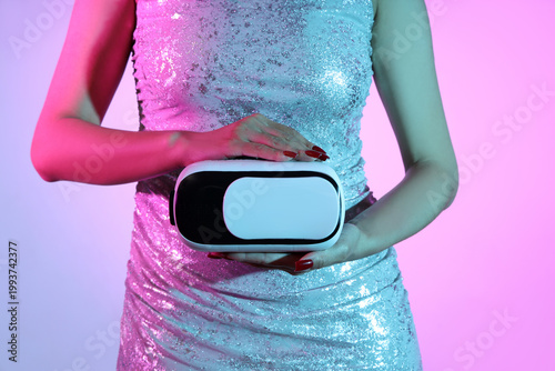 Young woman with VR glasses...