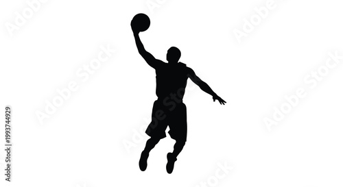 Silhouette of a basketball player mid air preparing to shoot or dunk