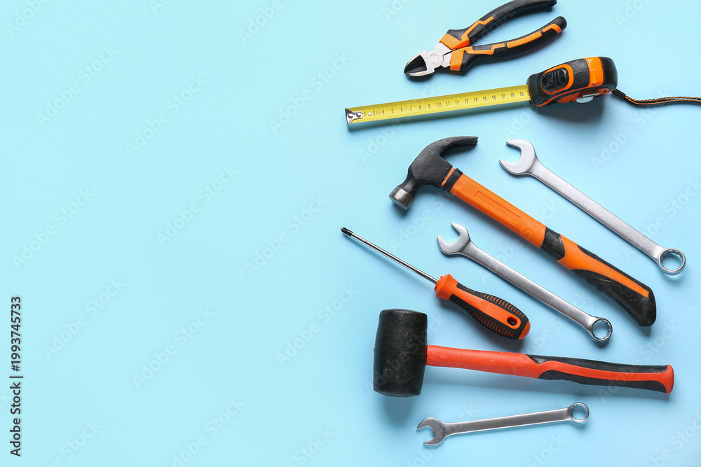 Obraz premium Different construction tools on blue background