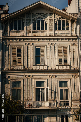 Elegant Wooden Facade Illuminated With Gentle Sunset Glow Highlighting Intricate Decorative Elements