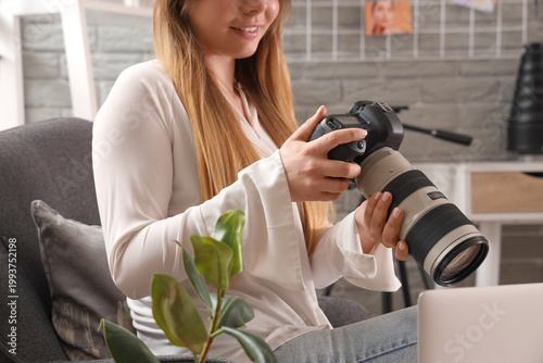 Female photographer with ca...