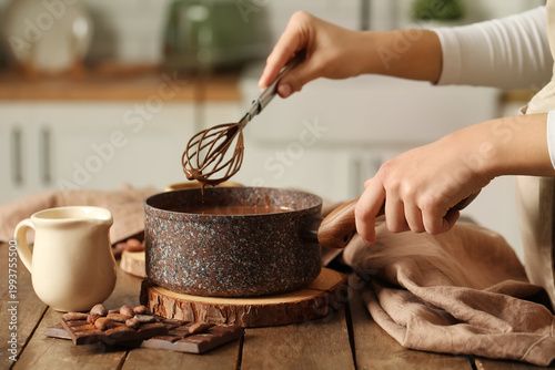 Woman stirring delicious ch...