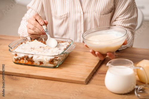 Beautiful mature woman cook...