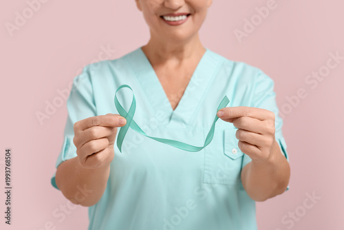 Smiling mature woman holdin...