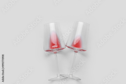 Glasses with leftover red w...