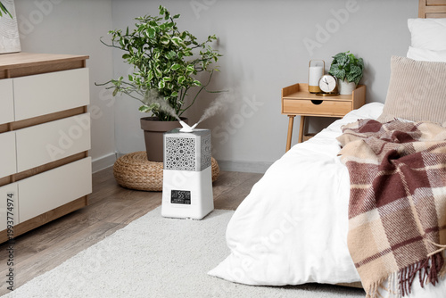 Modern humidifier on floor ...