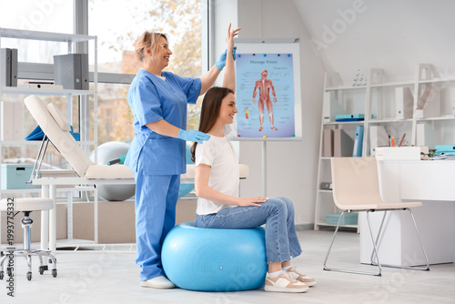 Mature female osteopath wit...