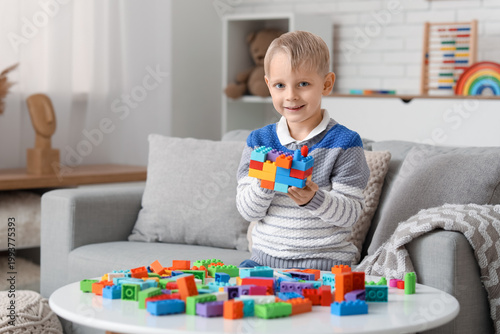 Happy cute little boy playi...