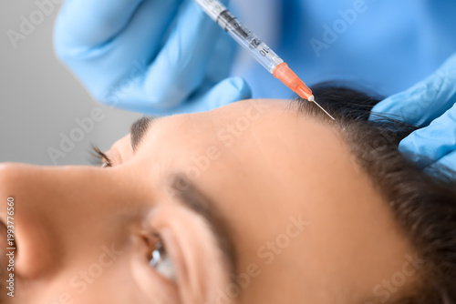 Young man receiving injecti...